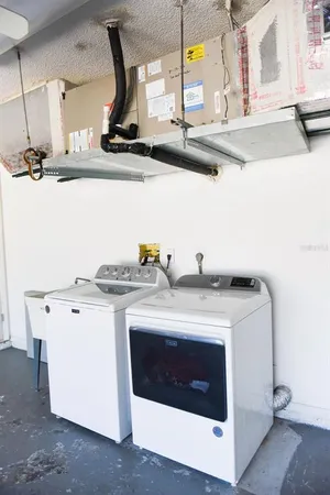 an empty room with a ceiling fan and a window