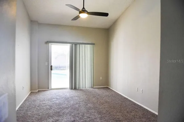 an empty room with windows and closet