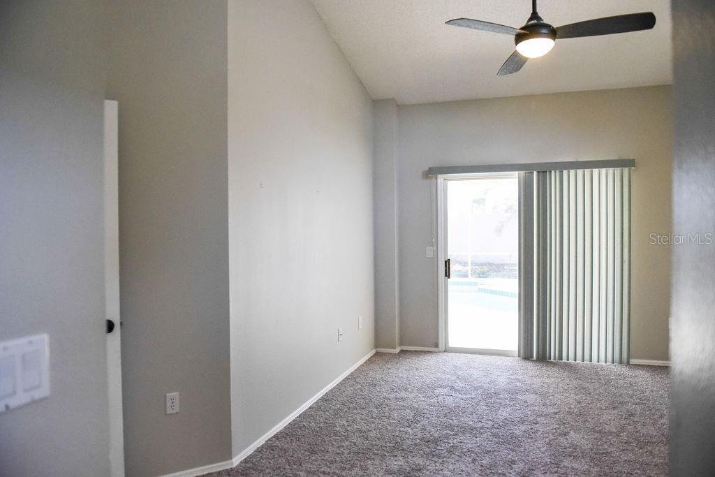 4819 West Raintree Bradenton, FL 34203 - Photo 19 of 37 an empty room with windows and closet