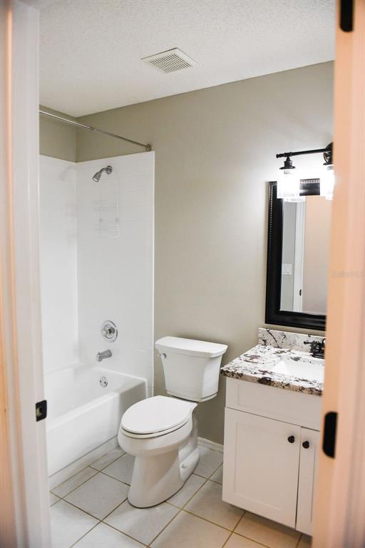 4819 West Raintree Bradenton, FL 34203 - Photo 23 of 37 a bathroom with a sink a toilet and shower