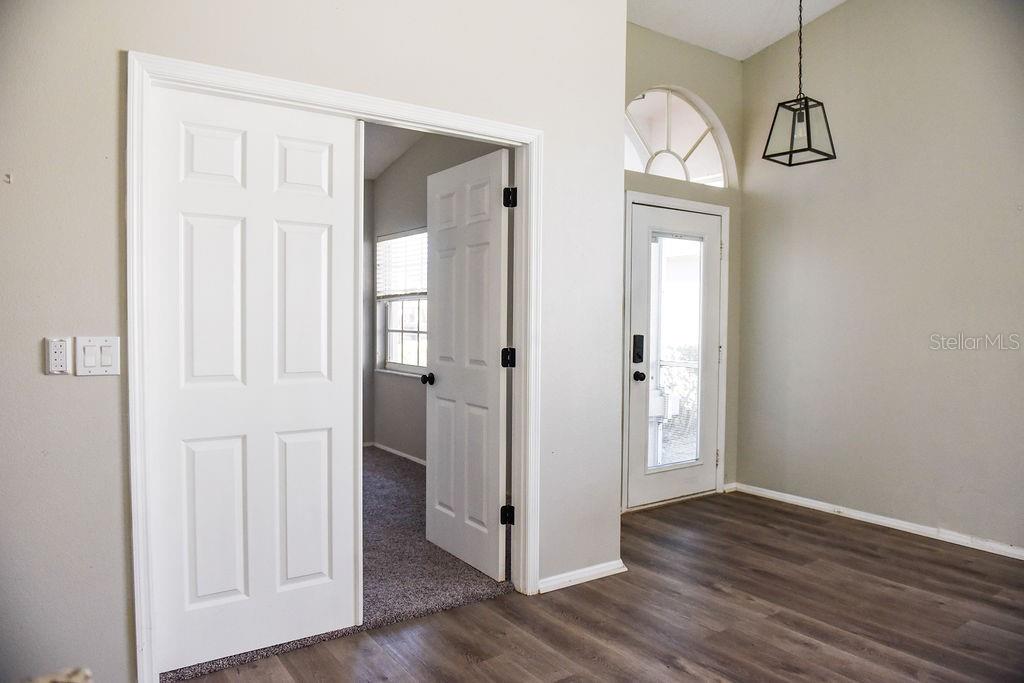 4819 West Raintree Bradenton, FL 34203 - Photo 25 of 37 a view of a hallway with wooden floor