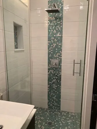 a bathroom with a shower and a sink