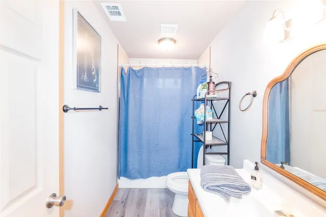 a bed room with furniture and wooden floor