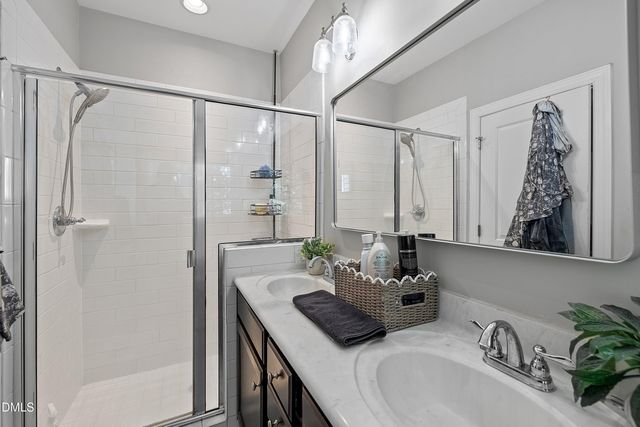 a bathroom with a tub and a window