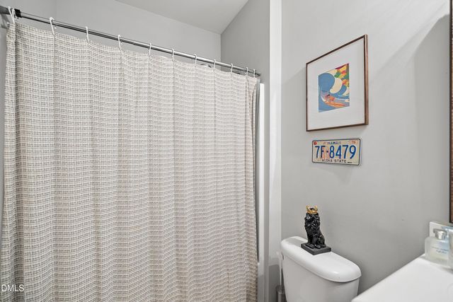 a bedroom with furniture and a wooden floor