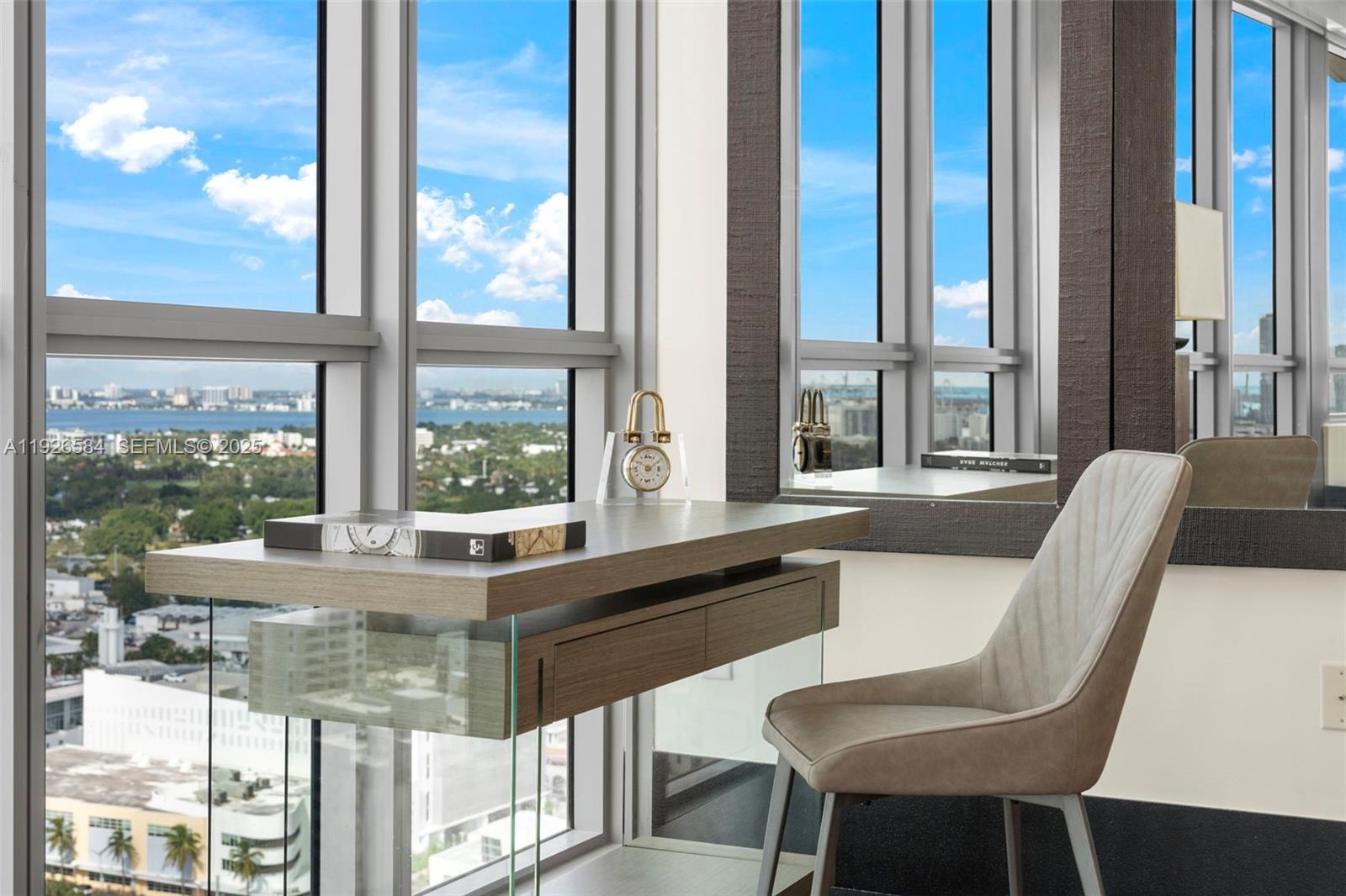 101 20th Street, Unit 3202 Miami Beach, FL 33139 - Photo 20 of 54 a dining room with furniture and large windows