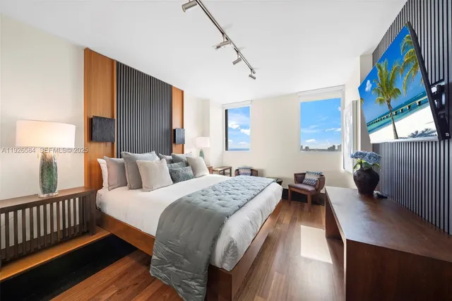 a bedroom with bed and window