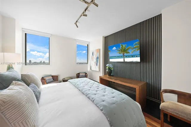 a view of a room that has a bed and a window