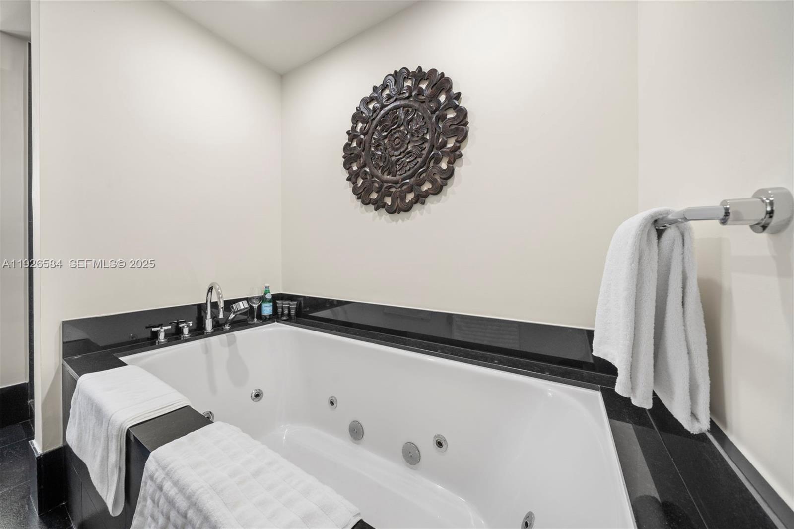 101 20th Street, Unit 3202 Miami Beach, FL 33139 - Photo 38 of 54 a bathroom with a bathtub and a shower