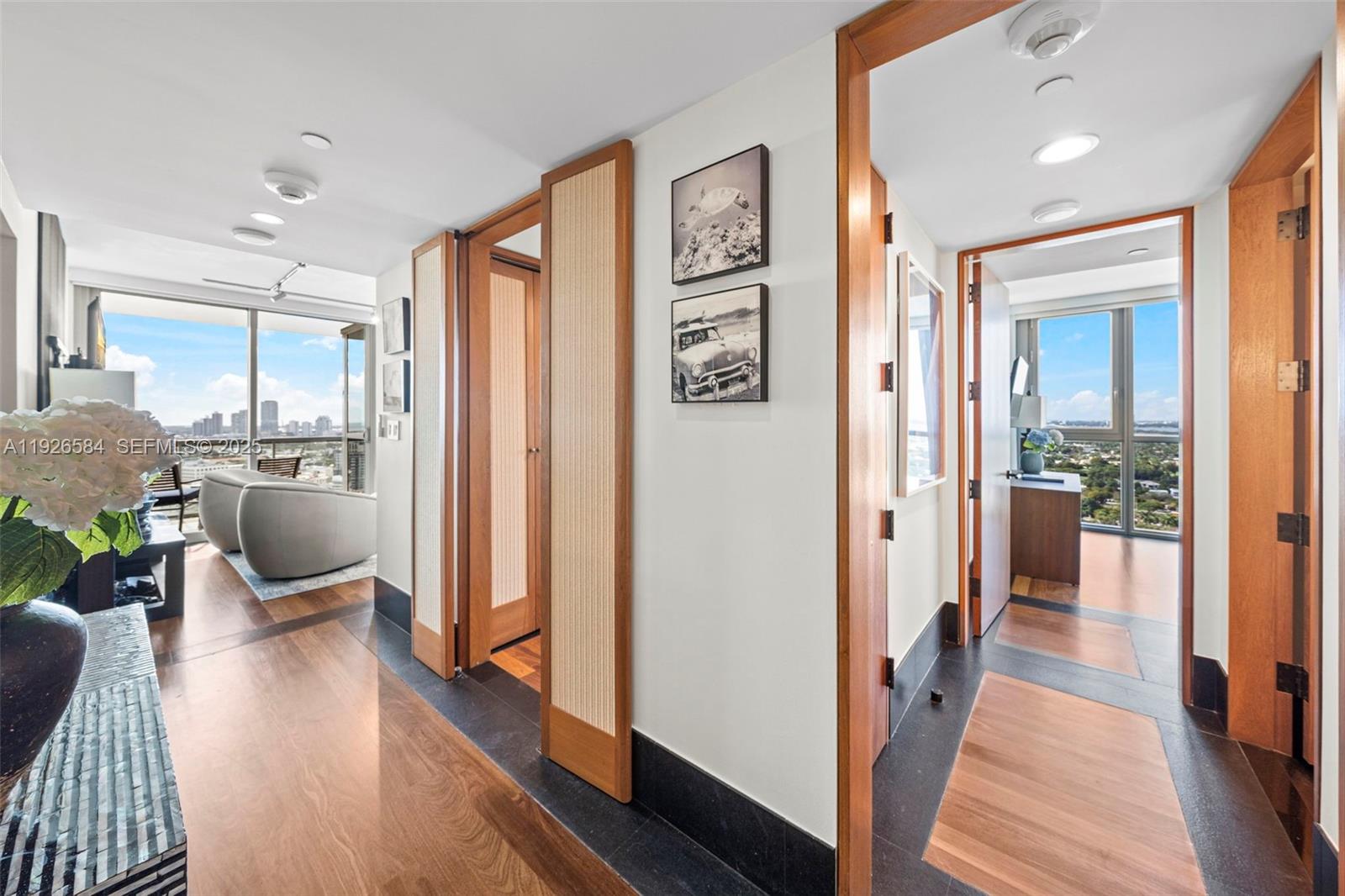 101 20th Street, Unit 3202 Miami Beach, FL 33139 - Photo 5 of 54 a view of a hallway with wooden floor and furniture