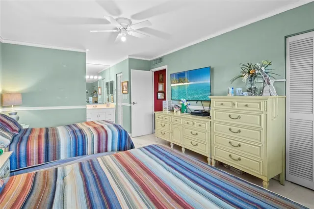 a bedroom with two large bed and a dresser