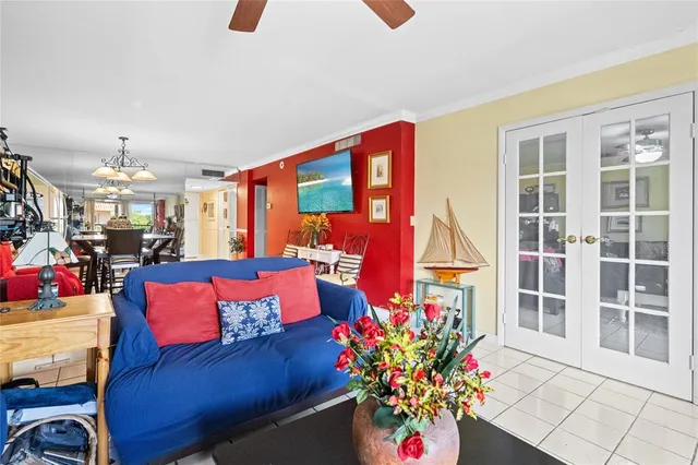 a living room with furniture and flowers