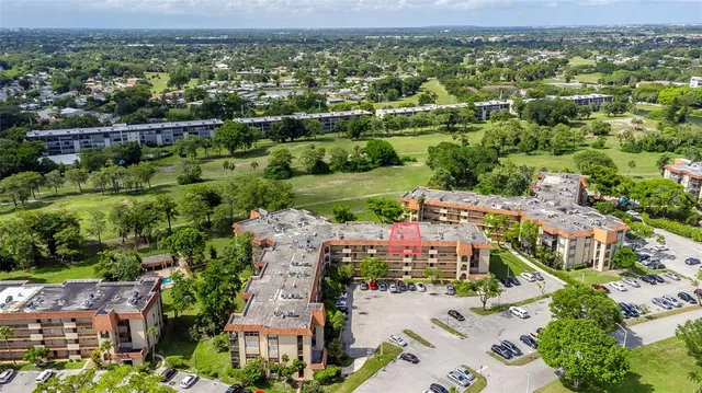 an aerial view of a house with a garden