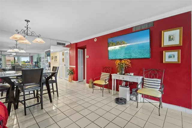 a dining room with furniture and a chandelier