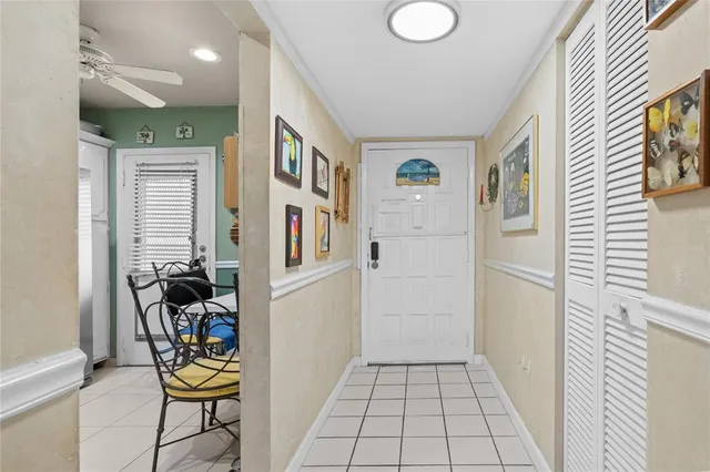 a view of kitchen with furniture and refrigerator