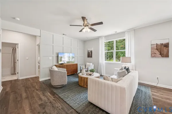 a living room with furniture and a window