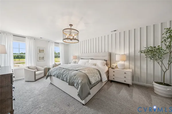 a bed room with a bed and a large window