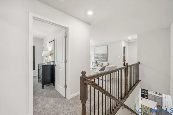 a view of a hallway with a bathroom