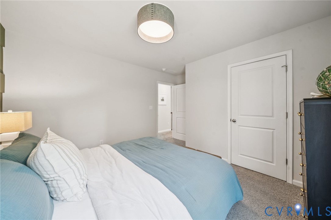 Lot 12 Rte 1 Richmond, VA 23237 - Photo 41 of 45 a bedroom with a bed and a chandelier