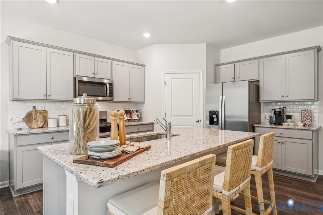 Lot 12 Rte 1 Richmond, VA 23237 - Photo 9 of 45 a kitchen with kitchen island granite countertop a sink stove and refrigerator