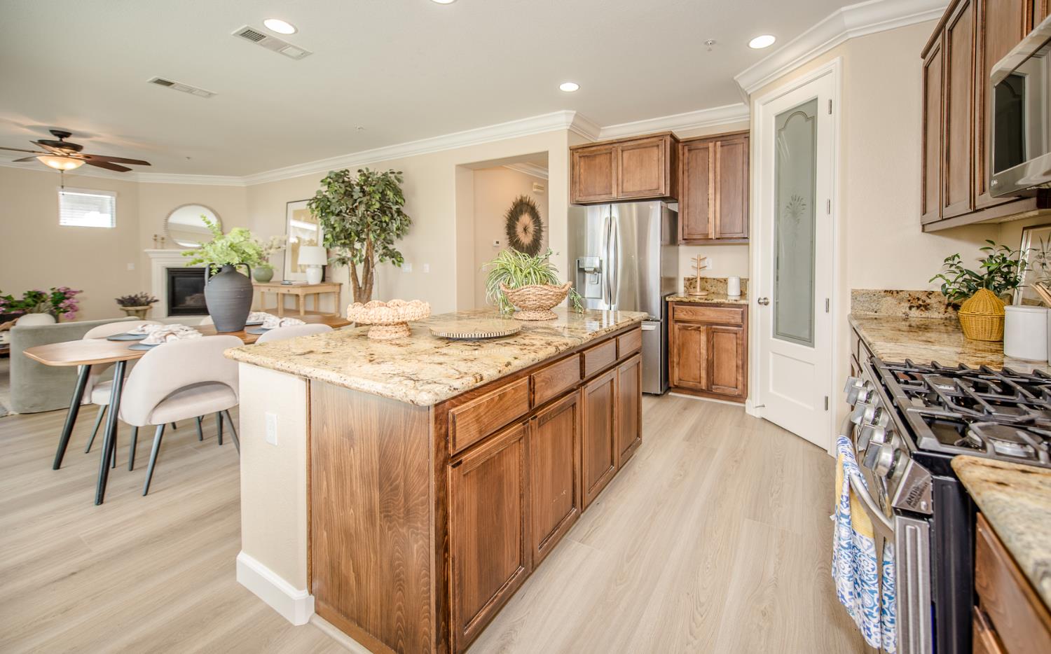 1701 Sandypoint Road West Sacramento, CA 95691 - Photo 13 of 41 a kitchen with stainless steel appliances kitchen island granite countertop a stove a sink and a refrigerator