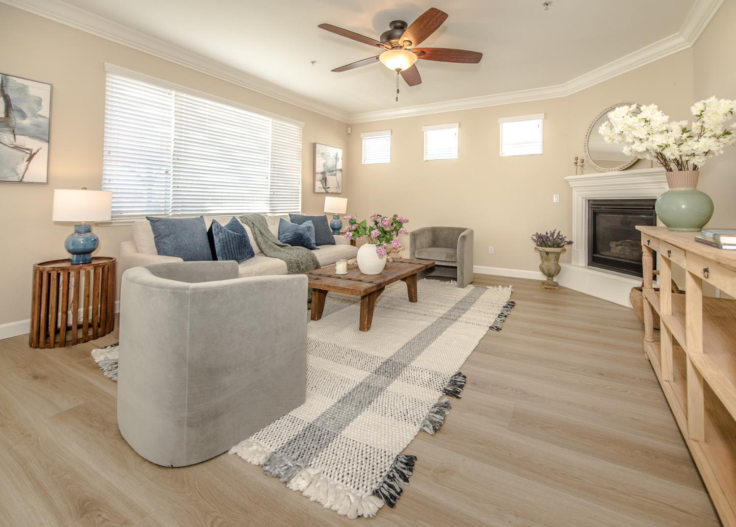 1701 Sandypoint Road West Sacramento, CA 95691 - Photo 15 of 41 a living room with furniture a chandelier and a fireplace