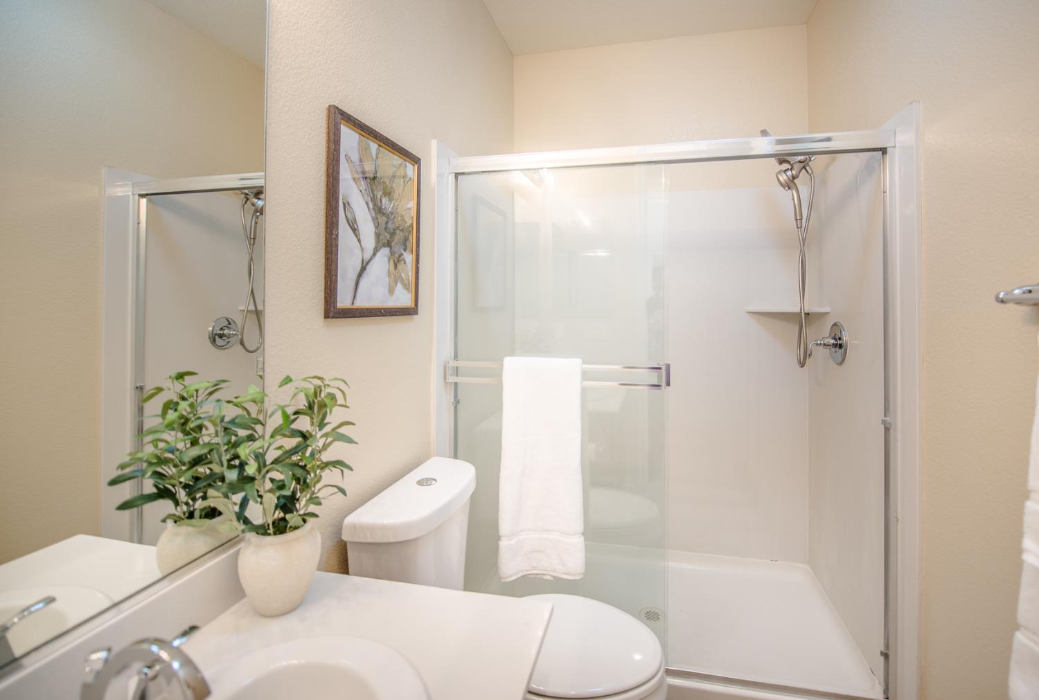 1701 Sandypoint Road West Sacramento, CA 95691 - Photo 20 of 41 a bathroom with a sink mirror vanity and toilet