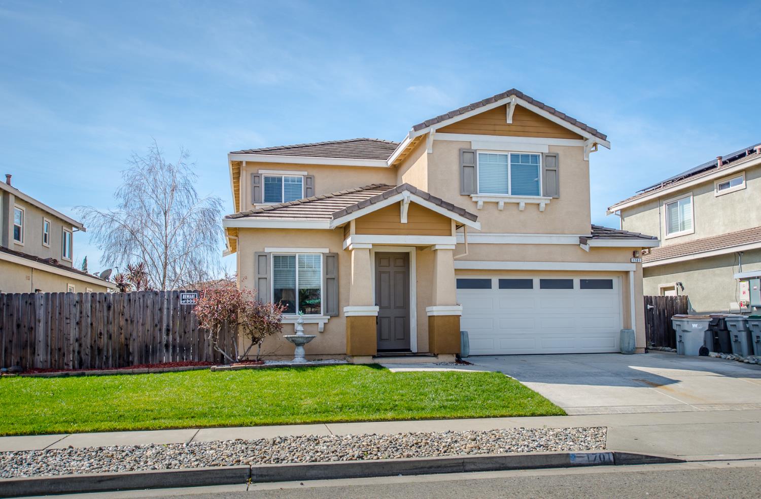 1701 Sandypoint Road West Sacramento, CA 95691 - Photo 2 of 41 a front view of a house with a yard and garage