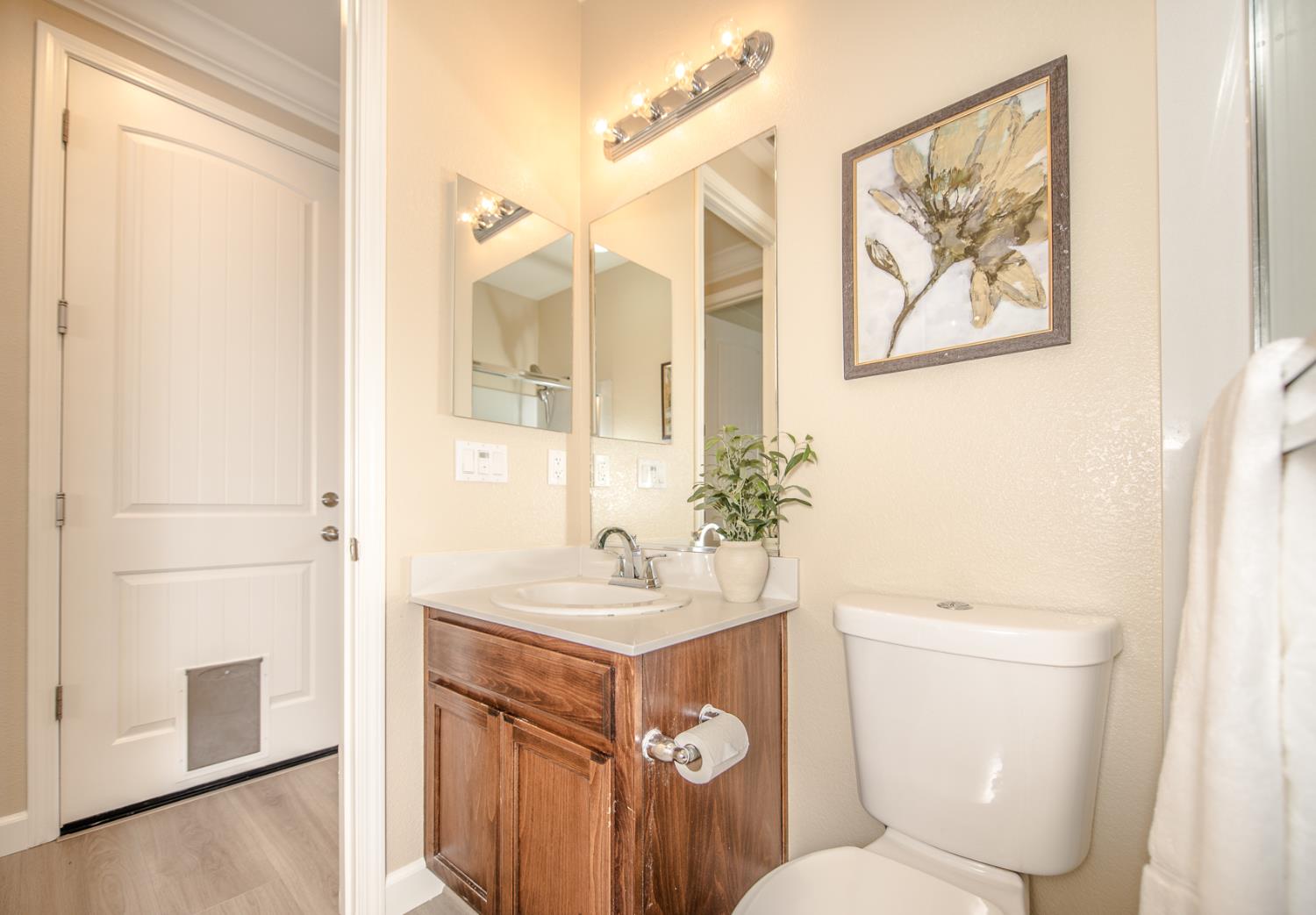 1701 Sandypoint Road West Sacramento, CA 95691 - Photo 21 of 41 a bathroom with a sink a toilet and shower curtain
