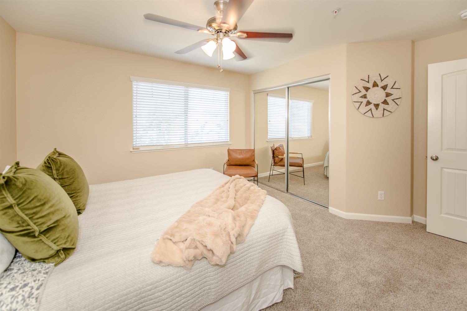 1701 Sandypoint Road West Sacramento, CA 95691 - Photo 26 of 41 a bed sitting in a bedroom next to a window and a chandelier
