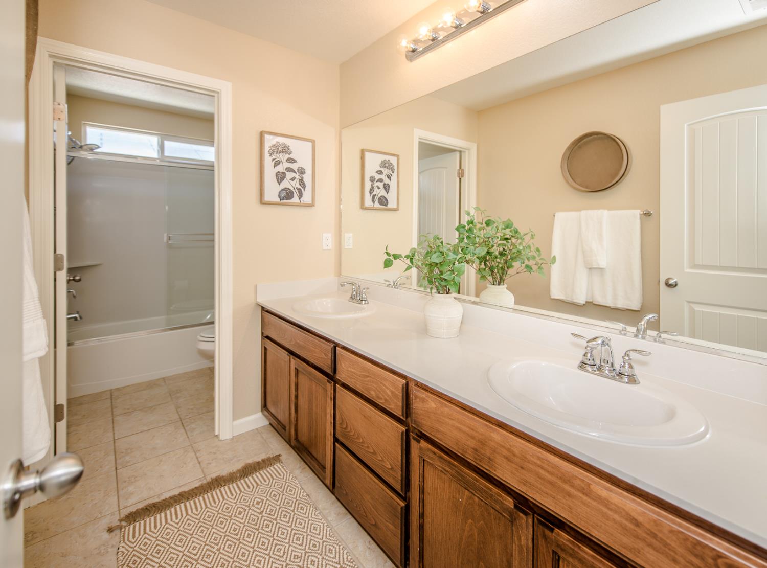 1701 Sandypoint Road West Sacramento, CA 95691 - Photo 28 of 41 a bathroom with a double vanity sink mirror and bathtub
