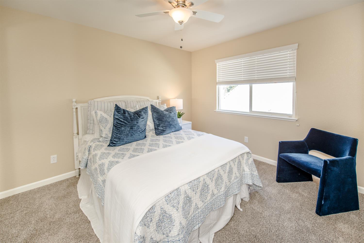 1701 Sandypoint Road West Sacramento, CA 95691 - Photo 29 of 41 a bedroom with a bed and a chandelier