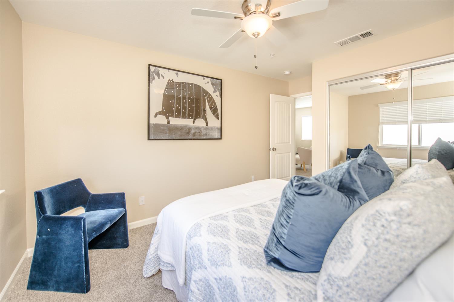 1701 Sandypoint Road West Sacramento, CA 95691 - Photo 30 of 41 a bedroom with a bed and a chandelier