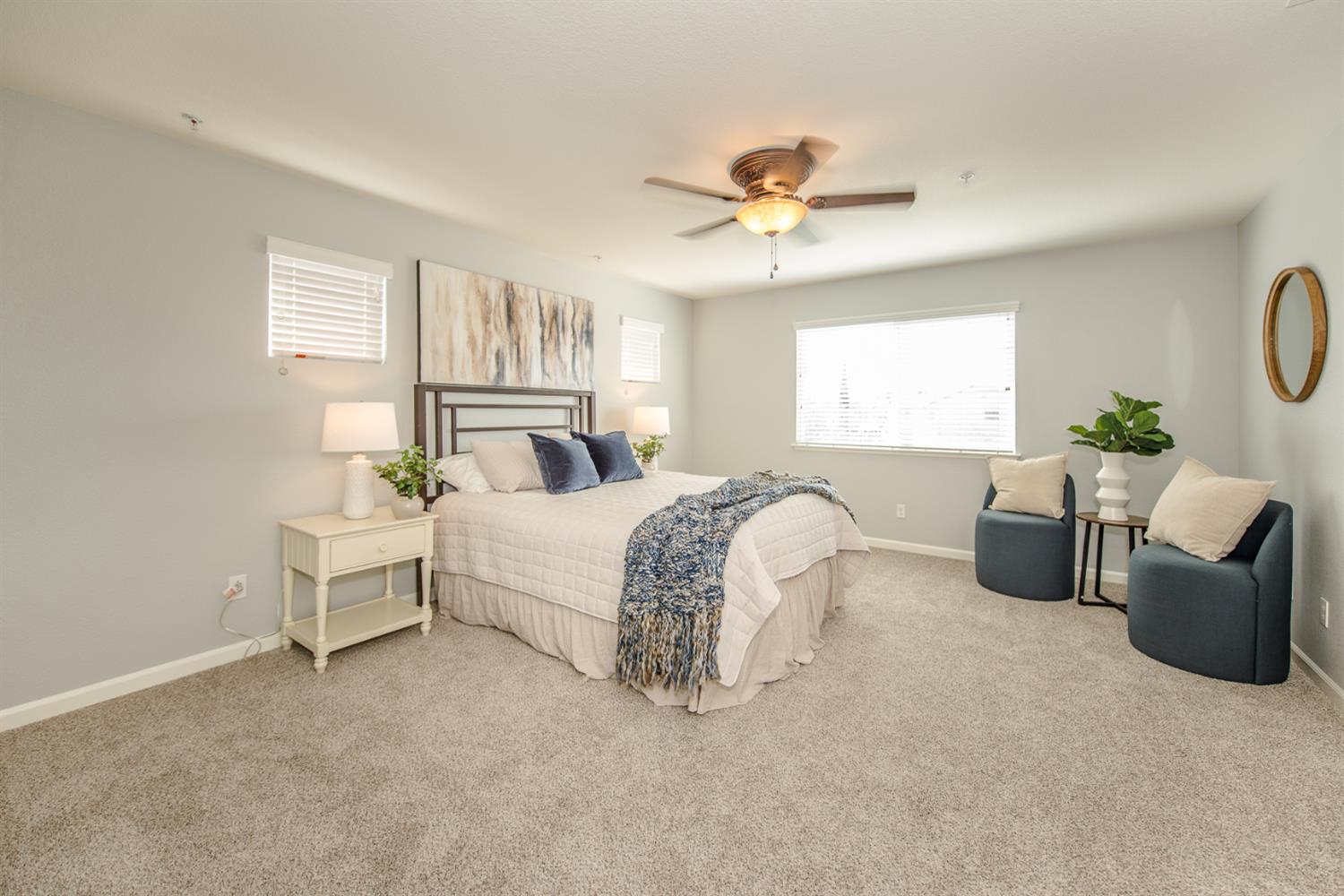 1701 Sandypoint Road West Sacramento, CA 95691 - Photo 33 of 41 a spacious bedroom with a bed a couch and windows