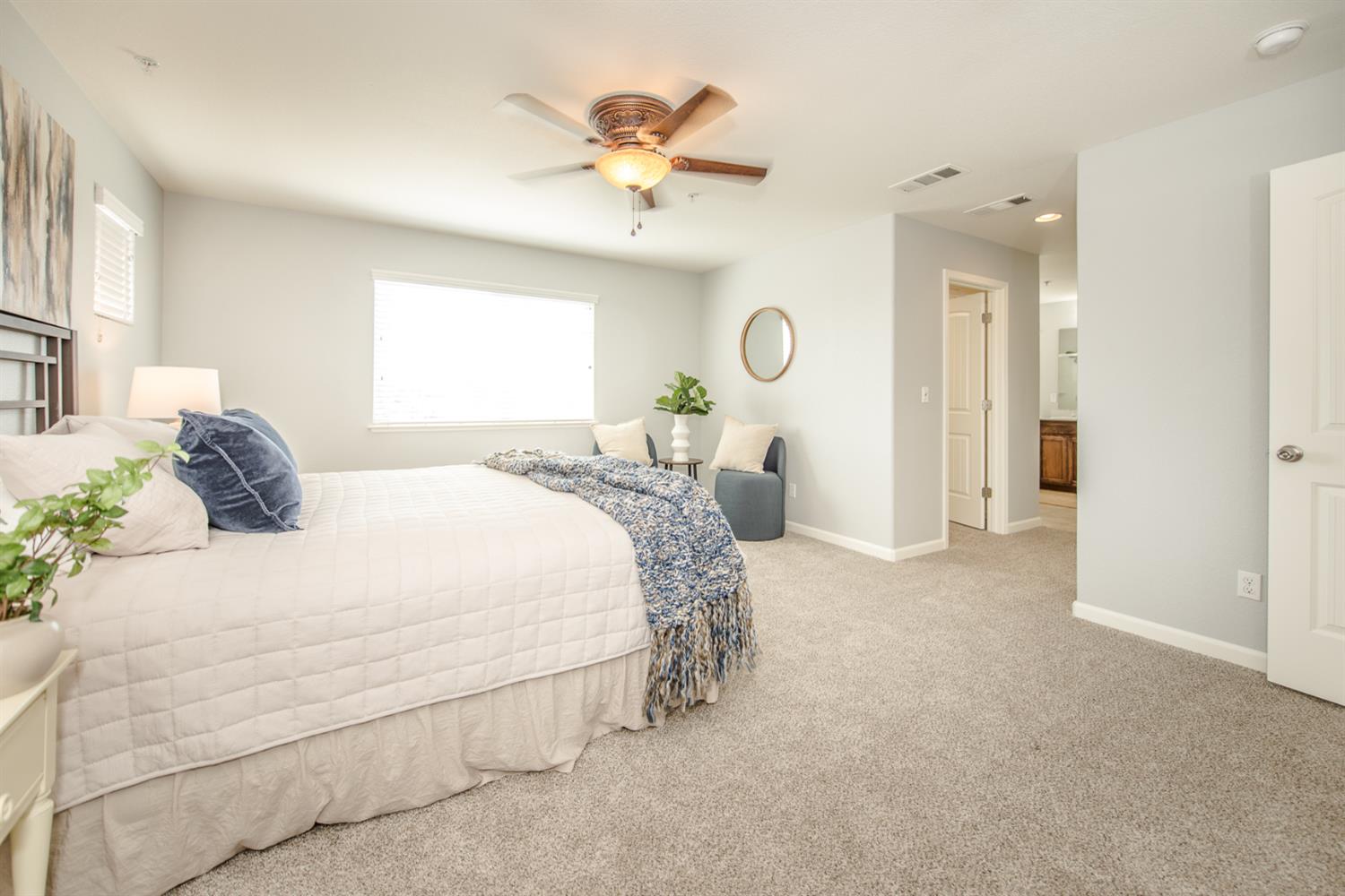 1701 Sandypoint Road West Sacramento, CA 95691 - Photo 34 of 41 a spacious bedroom with a bed and a chandelier