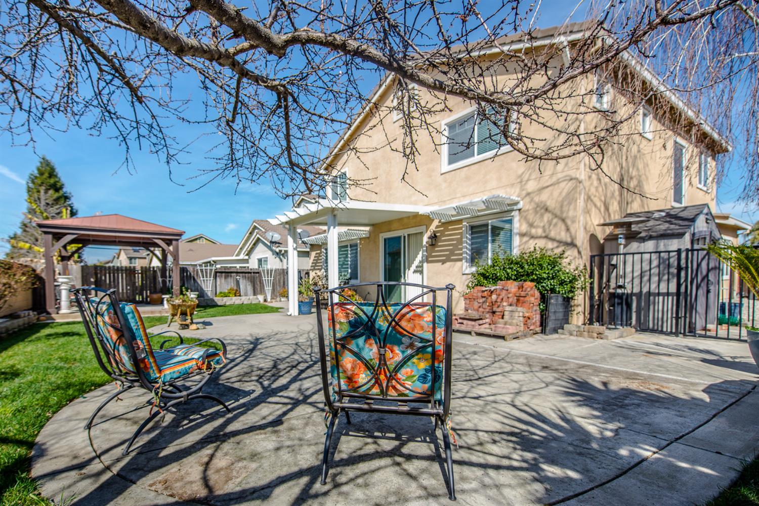 1701 Sandypoint Road West Sacramento, CA 95691 - Photo 38 of 41 a view of a patio with table and chairs barbeque potted plants and large tree