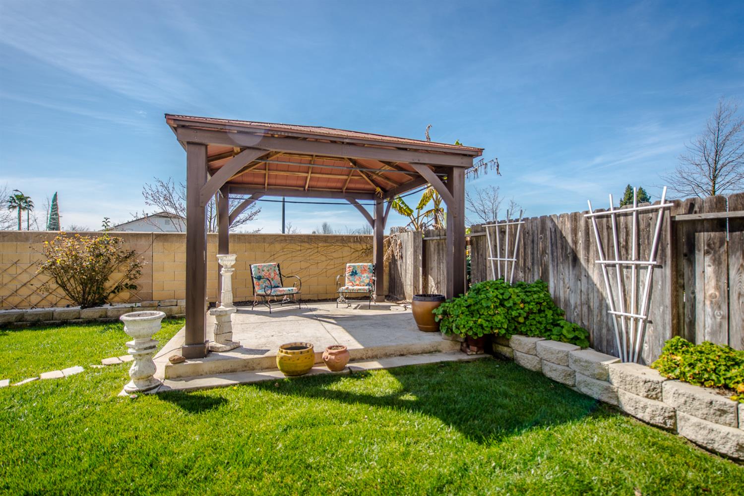 1701 Sandypoint Road West Sacramento, CA 95691 - Photo 40 of 41 a view of a backyard with table and chairs and potted plants