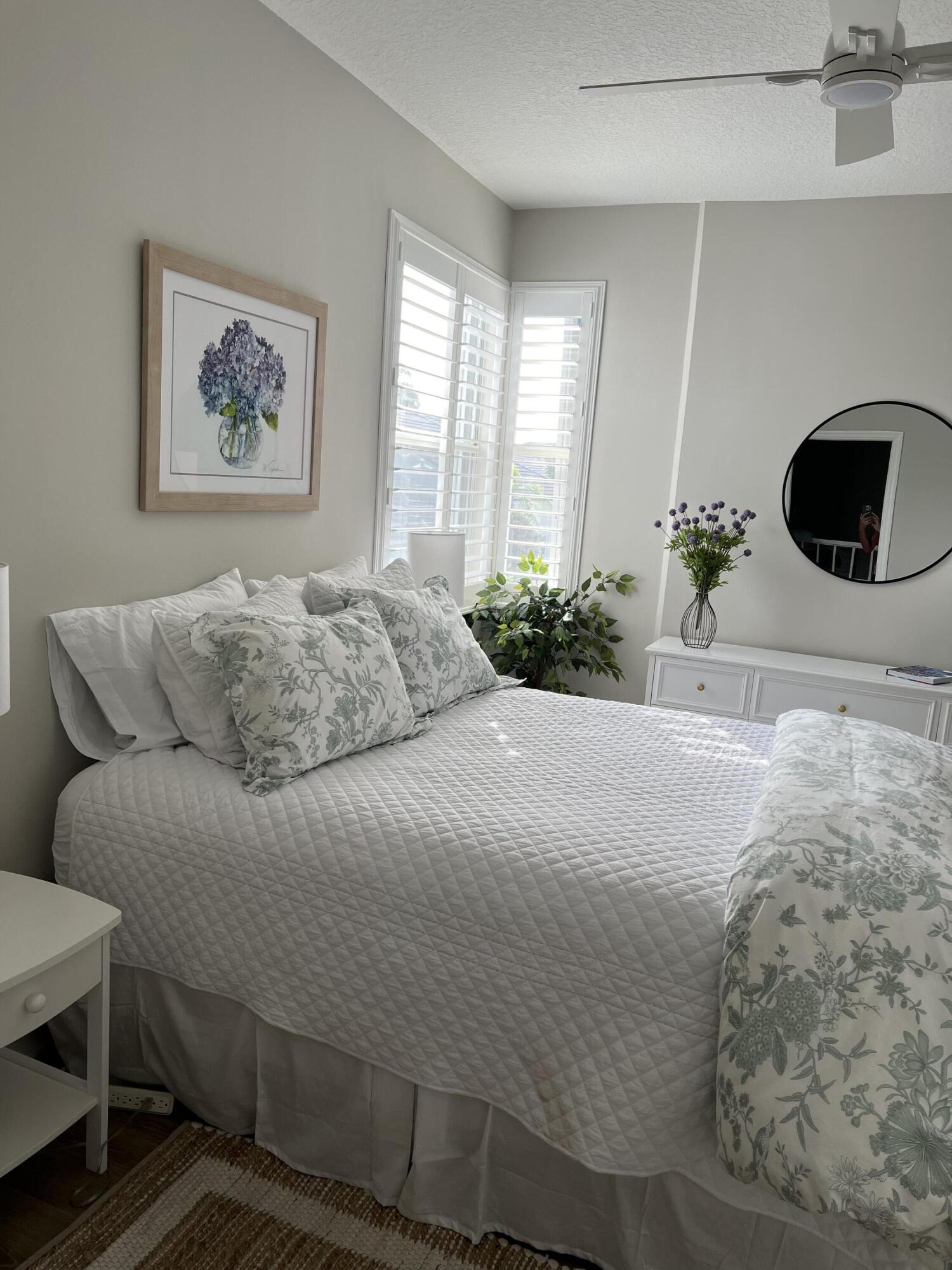 3028 Windward Way Jupiter, FL 33477 - Photo 14 of 48 a bedroom with a bed and a painting on the wall