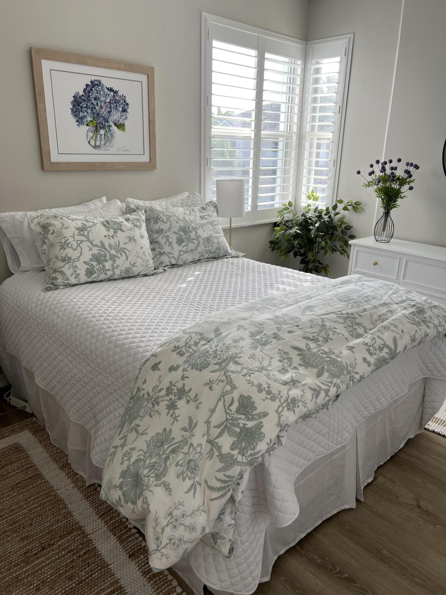 3028 Windward Way Jupiter, FL 33477 - Photo 16 of 48 a bedroom with a large bed and a large window