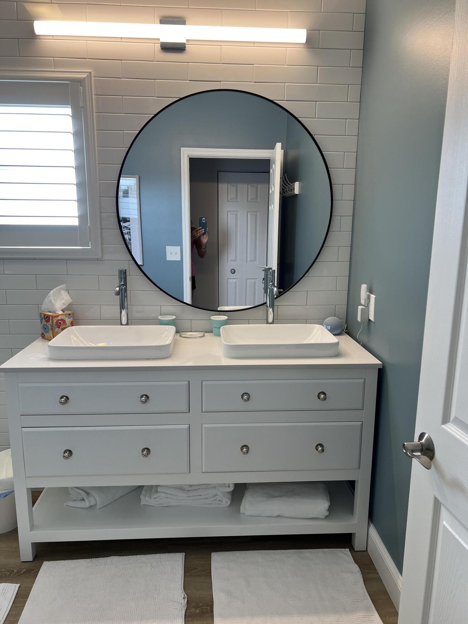 3028 Windward Way Jupiter, FL 33477 - Photo 18 of 48 a bathroom with a sink double vanity and a mirror