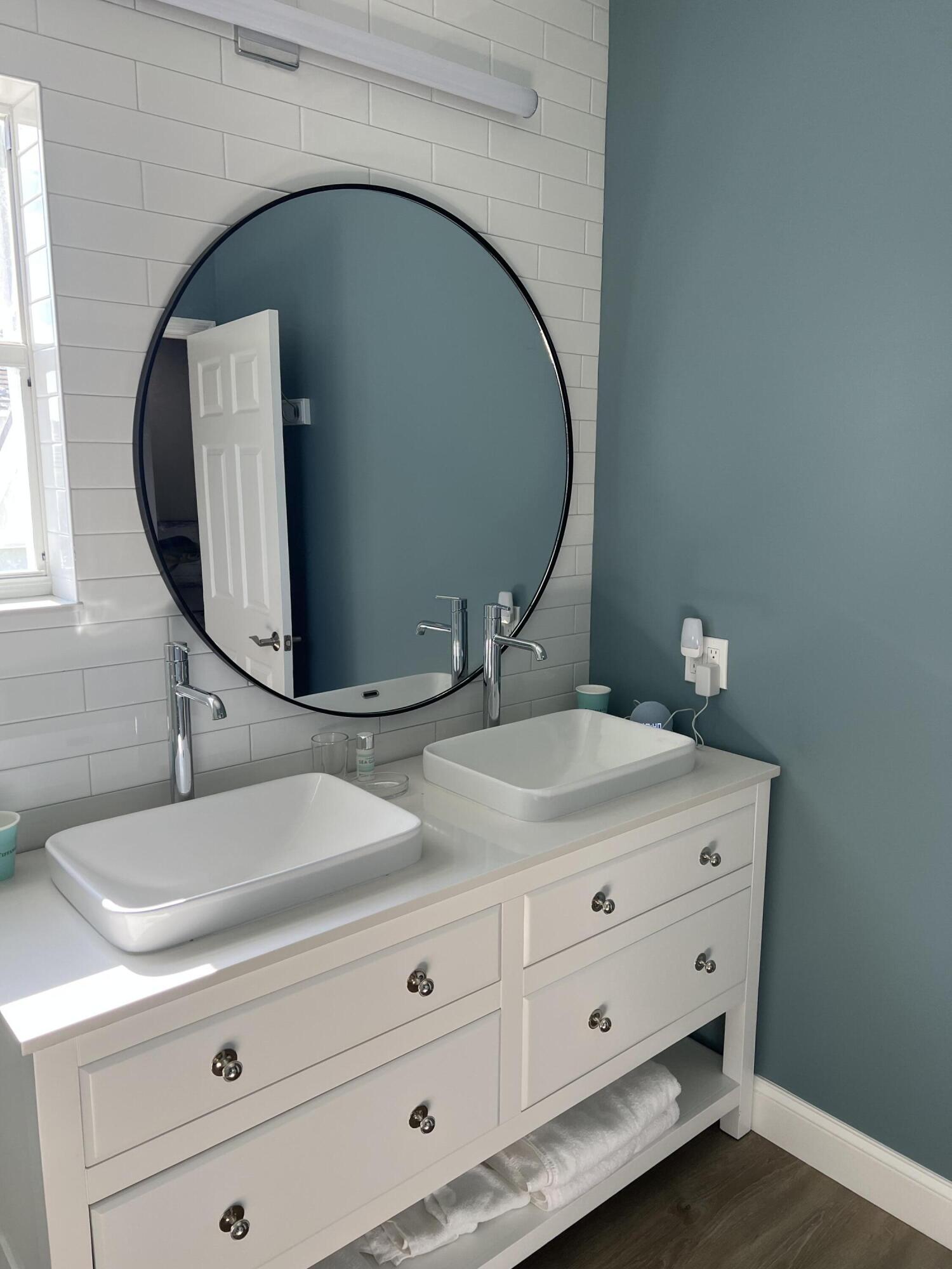 3028 Windward Way Jupiter, FL 33477 - Photo 19 of 48 a bathroom with a sink and mirror