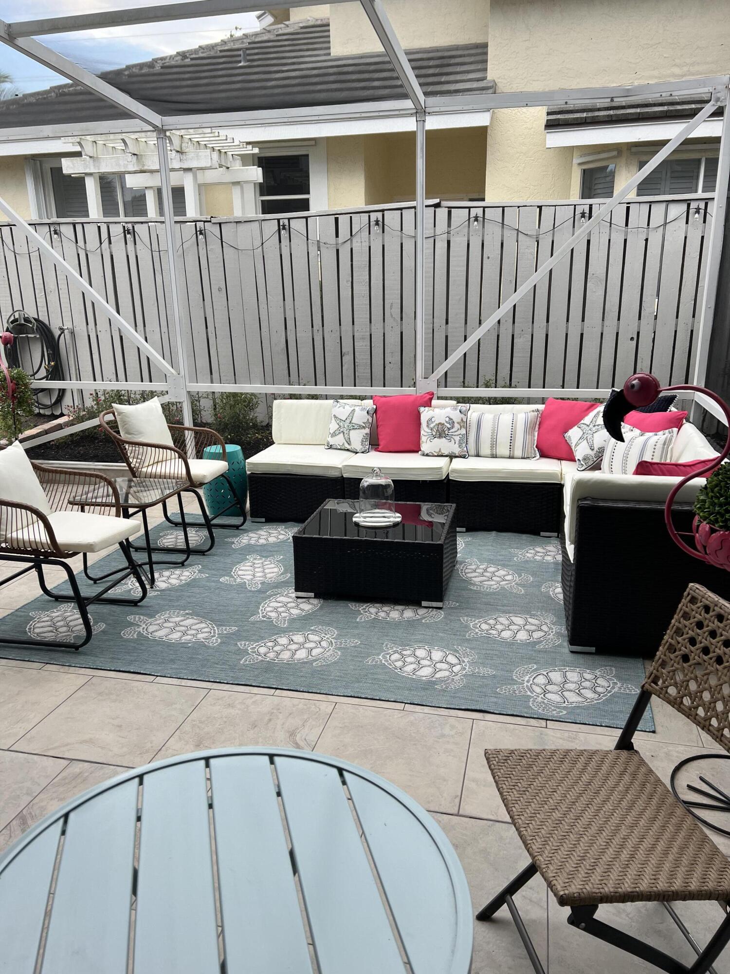 3028 Windward Way Jupiter, FL 33477 - Photo 29 of 48 a living room with a couch and a table