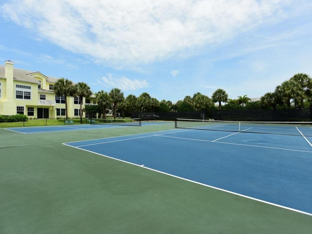 3028 Windward Way Jupiter, FL 33477 - Photo 40 of 48 a view of an outdoor space and tennis court