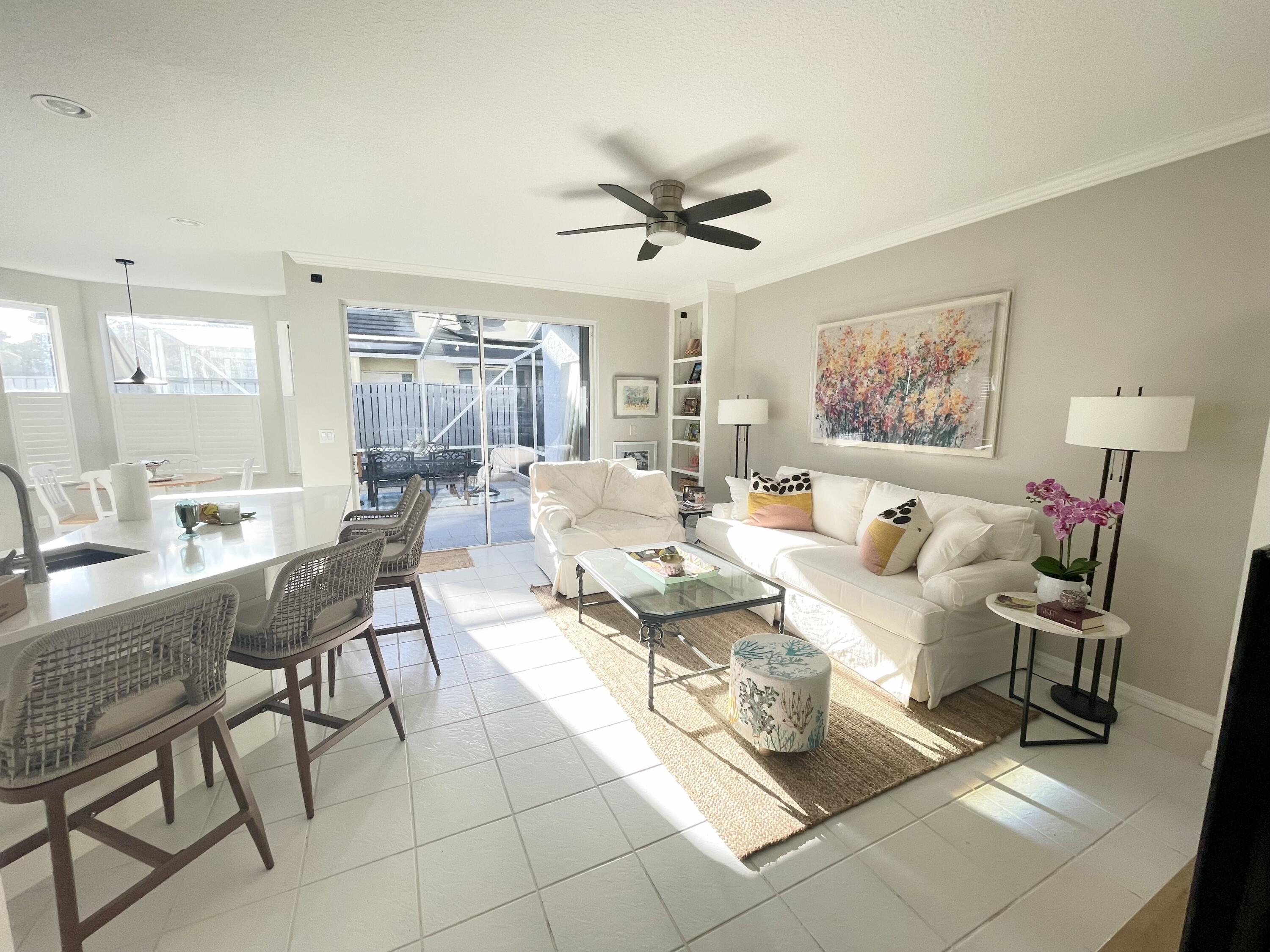 3028 Windward Way Jupiter, FL 33477 - Photo 8 of 48 a living room with furniture and a large window