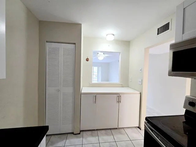 a view of an empty room and a window