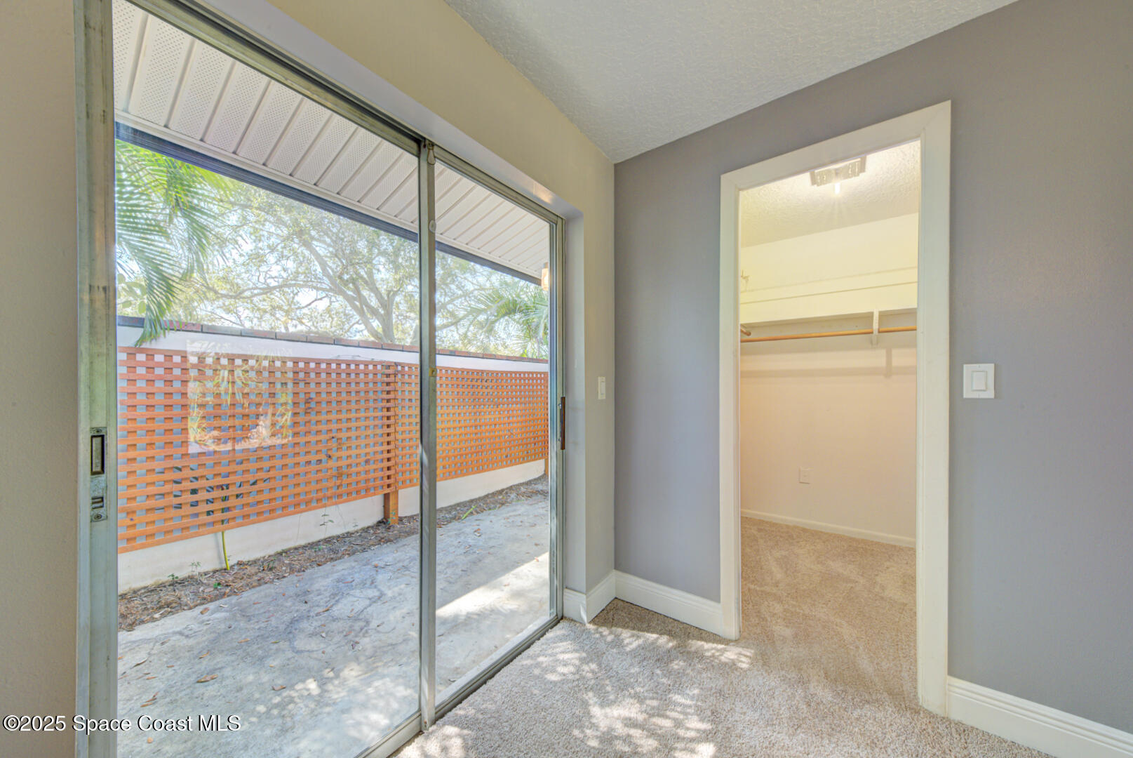 1240 St George Road Merritt Island, FL 32952 - Photo 28 of 46 master bedroom with slider to private pa