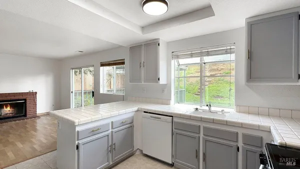 a kitchen with a sink and a window
