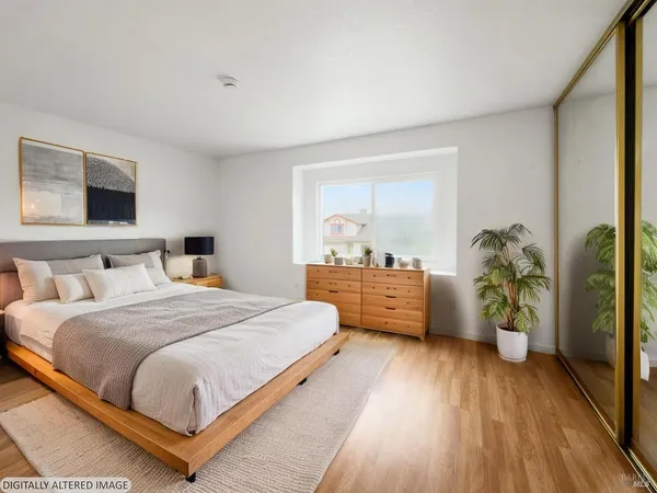 a bedroom with a bed and a dresser