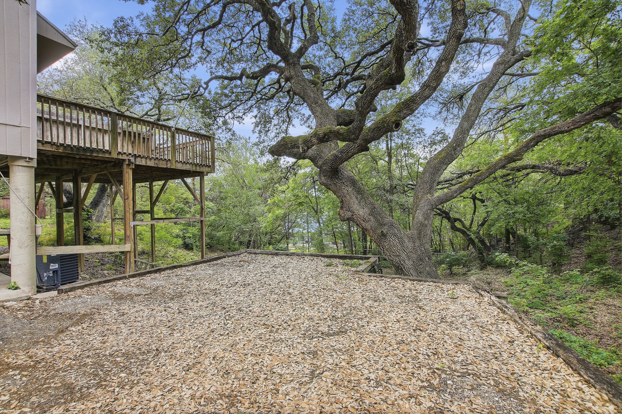 6902 Rifle Bend Austin, TX 78736 - Photo 28 of 33 a view of a house with a large tree