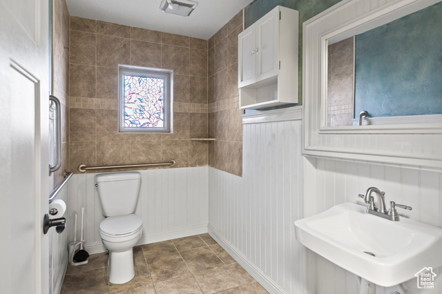 465 North Main Street Richfield, UT 84701 - Photo 17 of 43 Bathroom with tile patterned floors, toilet, visible vents, and a sink